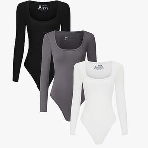 NEW. women’s long sleeve bodysuits.   Black white and gray S